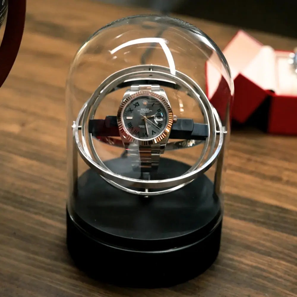 Remontoir gyroscopique pour montre automatique en verre et acier